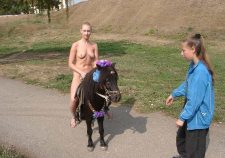 Blonde Naked Riding A Pony Near Kremlin