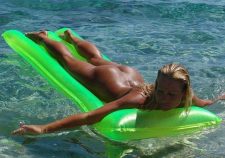 Nude Girls On Rafts Floating In Water