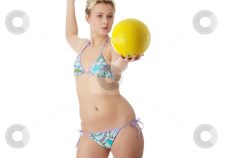 Teens In Bikinis Playing Volleyball