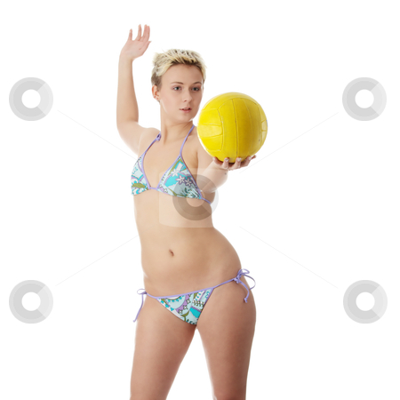 Teens In Bikinis Playing Volleyball