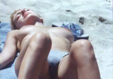 Topless Babe Caught Tanning On Beach