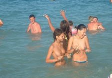 Topless Babes Caught Having Fun In The Water